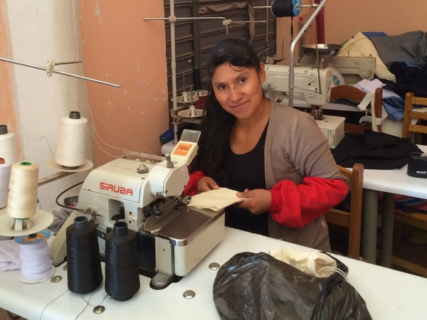 Elsa, an independent small-business owner, making the packaging by hand