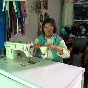 Señora Luzmarina with her own sewing machine, filling an order for pouches for Sacred Valley Salt