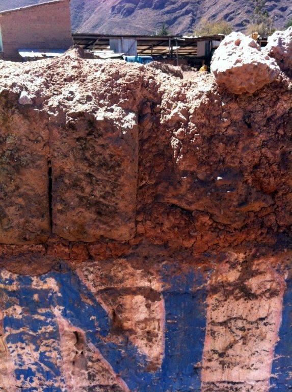 adobe wall eroded by rain