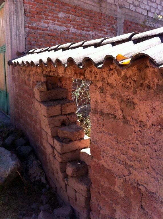 adobe wall protected from rain