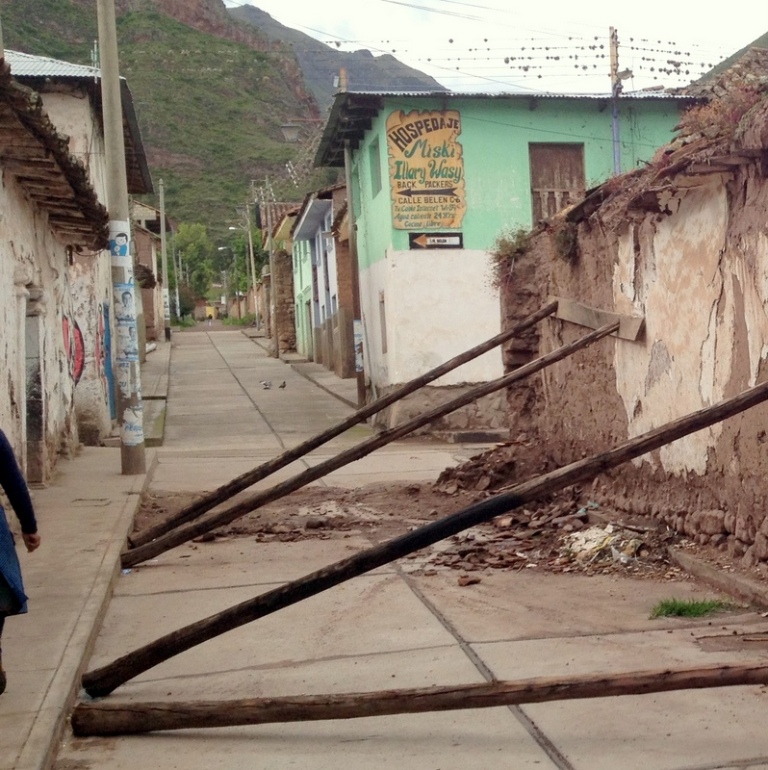 adobe wall falling over due to eroded base