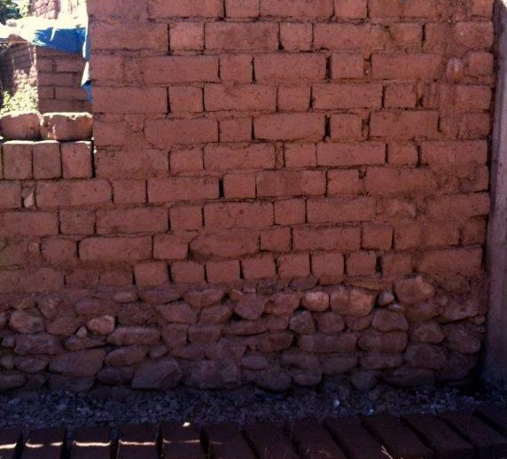 adobe wall with protected base