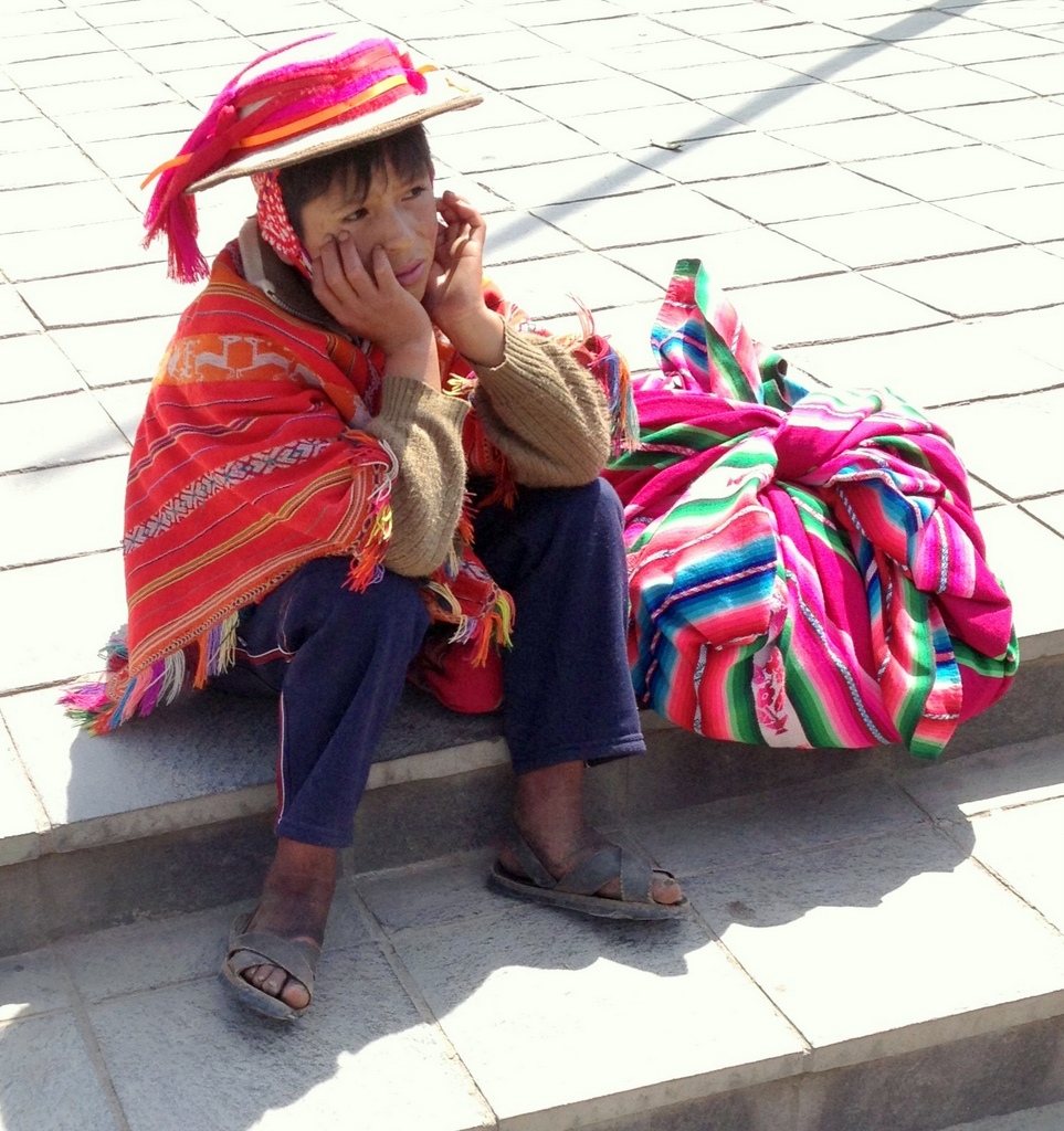 A young Peruvian man in Ollantaytambo wearing sandals made from the tread of old car tires