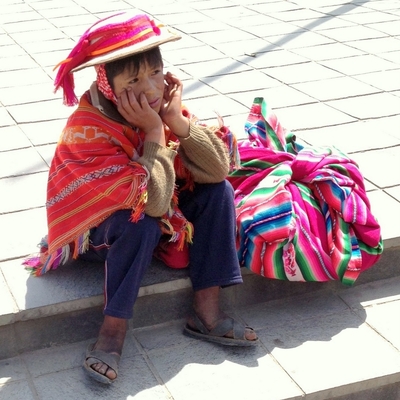 A young Peruvian man in Ollantaytambo wearing sandals made from the tread of old car tires